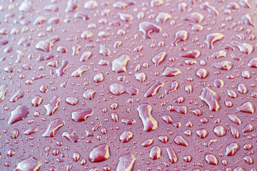 frozen drops of water on a metal surface