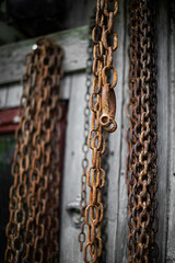 old, rusty iron chains orderly stored