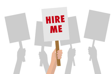 Hand holding 'HIRE ME' sign