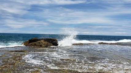 waves crashing on rocks
