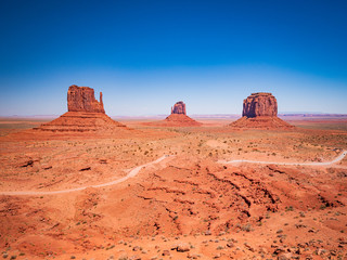 Fototapeta na wymiar Monument Valley from visitor center, region of Colorado Plateau characterized by cluster of vast sandstone buttes, Arizona Utah border.