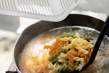 Vegetable rotini pasta soup with pork and carrot