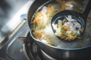 Vegetable rotini pasta soup with pork and carrot