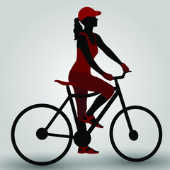 Fototapeta na wymiar Silhouettes of women on a bicycle