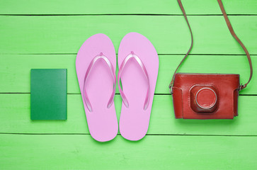 The concept of vacation on the beach, tourism. Summer traveler background. Flip flops, retro...