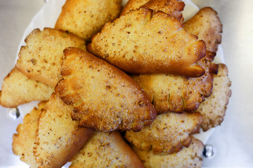 Homemade cake. Fresh rolls are on a platter. Close up. Top view