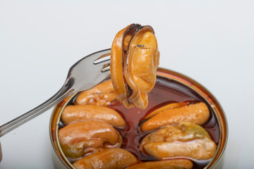 mussel held with a fork
