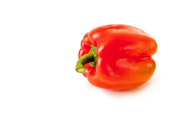 Red bell pepper highlighted on a white background, side view