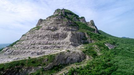 Flight of the camera by the mountain with the name Snake. Near the city of Mineralnye Vody of the Stavropol Territory in Russia. Video shot by DJI phantom 4 pro plus