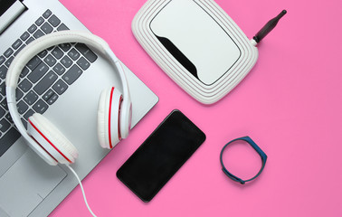 Modern digital gadgets and accessories. Laptop, smartphone, smart bracelet, headphones, wi-fi...
