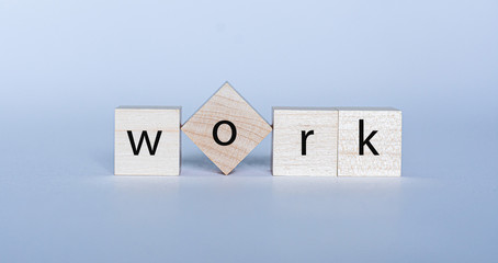 WORK the word on cubes on a background. Business concept.