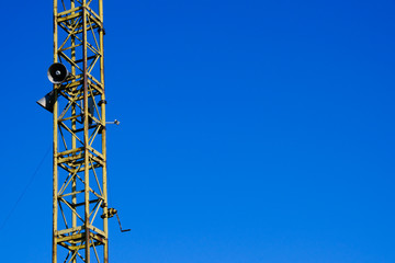steel tube lattice communication tower on blue sky background