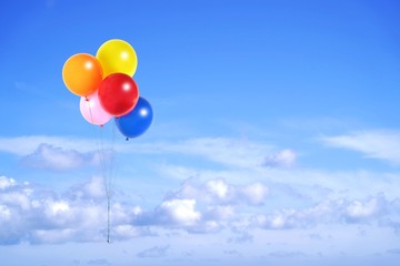 Colorful balloons flying in the sky © Hayati Kayhan