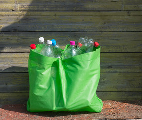 plastic bottles in a recycling bag. the concept of ecology