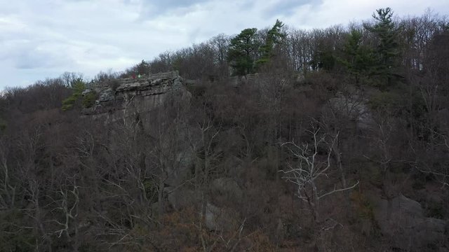 Aerial camera ascending revealing the Coopers Rock sandstone overlook.