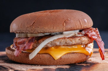 different options for serving a hamburger with cheese, bacon, cutlet, and sauce