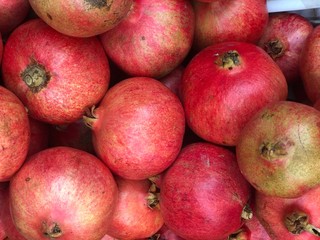 Fototapeta na wymiar Fresh pomegranate fruit in market.Healthy food concept.Full frame