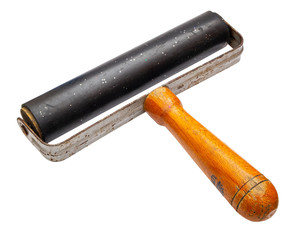 Old roller for rolling photos isolated on a white background