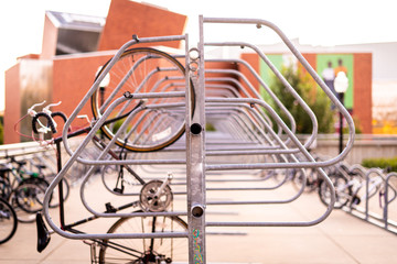 Bicycle wheel hanging vertically on rack