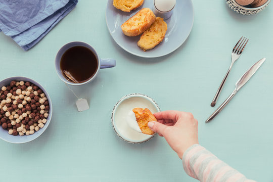 French fried toast with tea, boiled eggs and fresh yogurt. Tasty farmer breakfast.