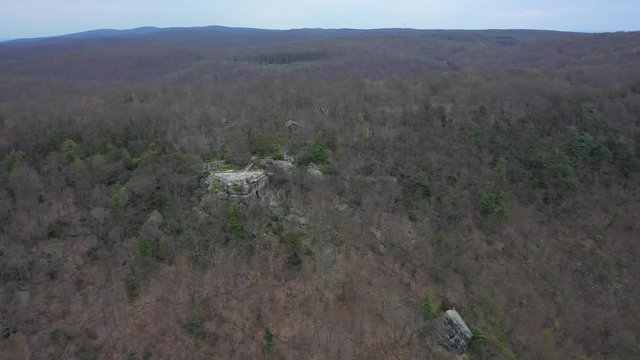 Aerial camera showing the Coopers Rock overlook and its position in the expansive forest.