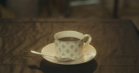 A cup of black coffee on the table