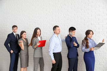 Obraz premium Business people waiting in line indoors