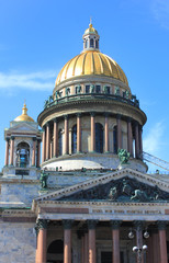 Fototapeta na wymiar Colonnade and golden dome of Saint Isaac's Cathedral in St Petersburg, Russia. Historic old church details, close up architecture view 