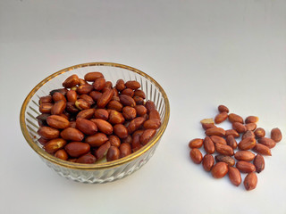 bowl of nuts spread, peanut on white background, Selective Focus.