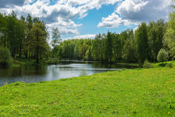 Beautiful countryside landscape. Green meadow and river. Spring Summer. Russia.