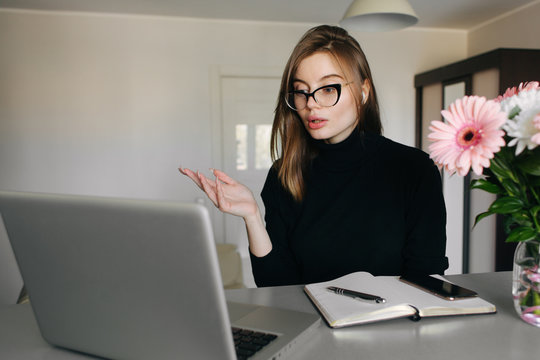 Young Woman European Woman Psychotherapist Giving Online Consultation With Someone At Home On Laptop From Video Call. Mental Health Concept.