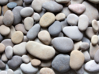 Background of sea pebbles and stones. Summer card. Seashore. Spa stones. Copy space