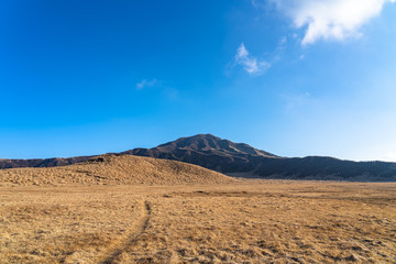 Kusasenri (kusasenri-ga-hama) prairie in January, Mt. Eboshi in the background. Aso Kuju National Park, Kumamoto Prefecture, Japan