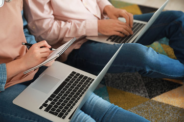 Young couple working together at home