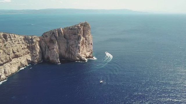 Aerial view of Capo Caccia Sardinian cliff with a lighthouse on the top 