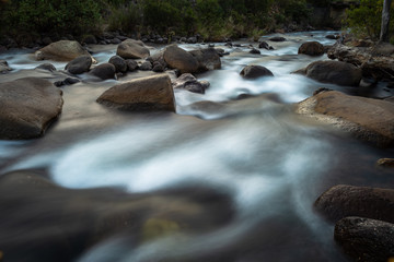 Fototapeta na wymiar A long exposure photo of a river in the central Drakensberg South Africa