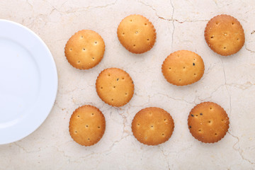 Flat lay composition with chocolate cookies and space for text on marble background
