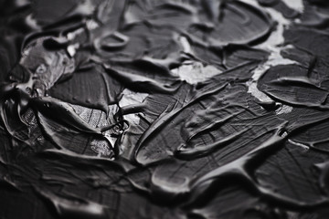 Acrylic black paint close-up. Texture background