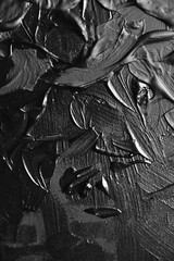 Acrylic black paint close-up. Texture background