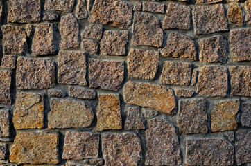 Texture of a wall built of granite stones
