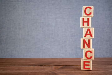 Word CHANCE text on wooden cubes on dark wooden backround. Business, Marketing, Growth concept.