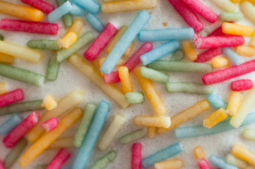 Decorating Easter baked pastry topping at home. Easter cake in sweet colorful decorations.