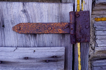 an old wooden door with an iron awning,old wooden door with lock