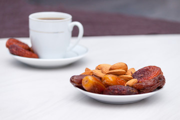 Healthy breakfast or snack concept. Black coffee, dried fruits. Copy space.