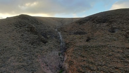 Sunset between mountains and ravines