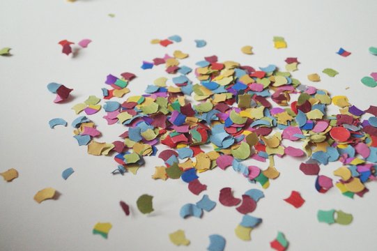 Close-up Of Confetti On White Table