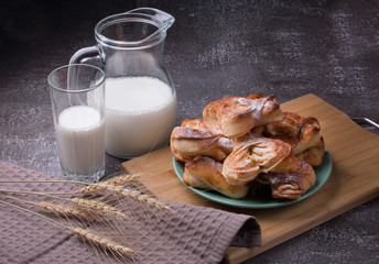 morning glass of milk and rolls for Breakfast. Bakery.