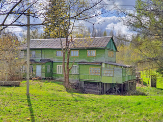 old mutant village house, indefinite form and architecture, green in a green forest, remnants of...