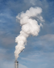 Smoke coming from the chimneys of the plant factory. Air pollution concept