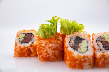 Japanese cuisine. Sushi roll on white background.